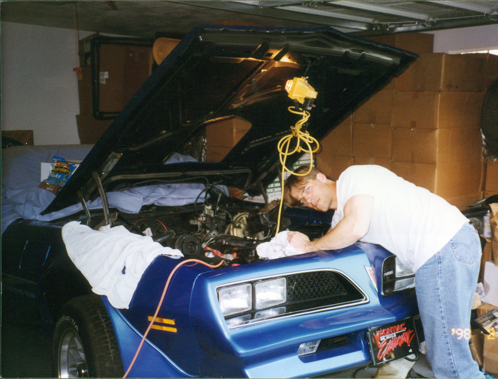 working in the garage back in the day on a blue Firebird Trans Am, 1998, courtesy of Trans Am Worldwide