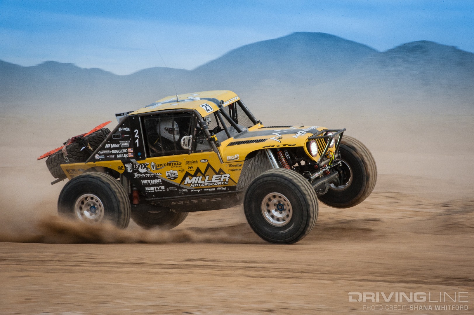Erik Miller 3-wheeling through the fast desert bumps