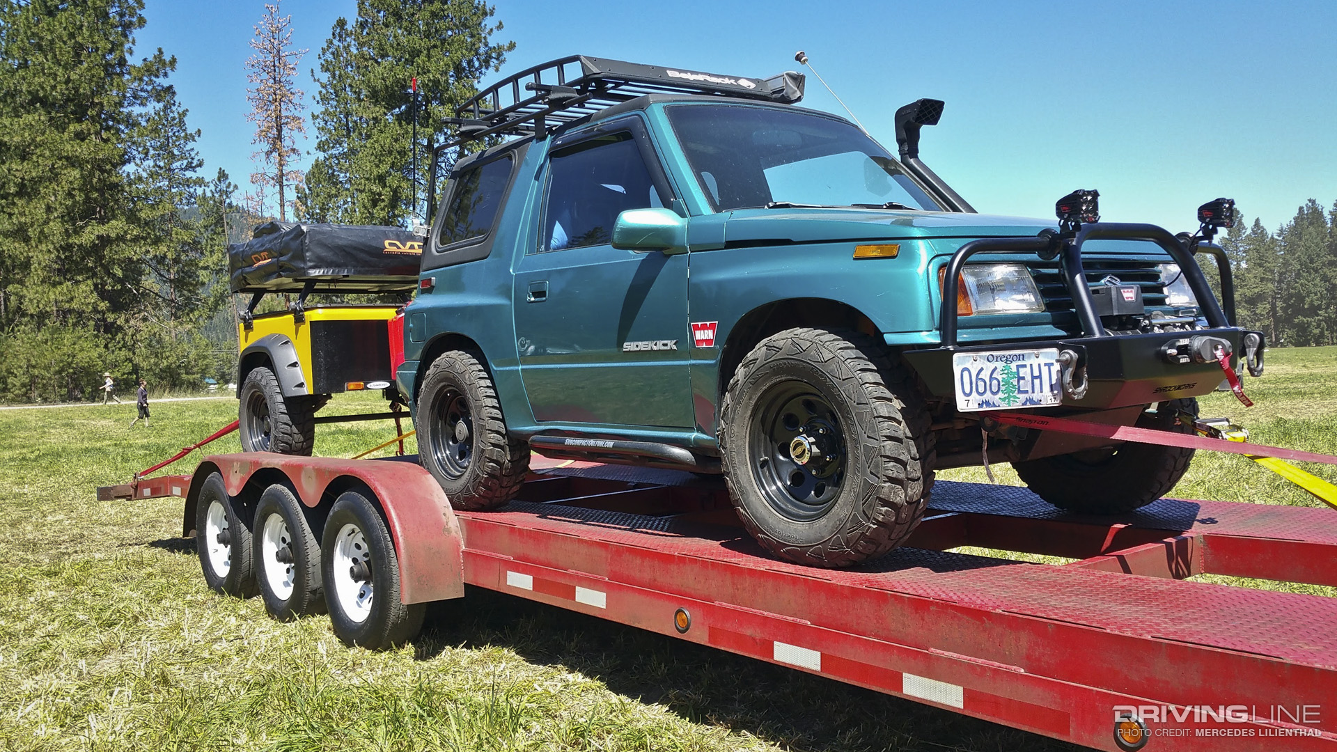 Suzuki Sidekick on flatbed trailer