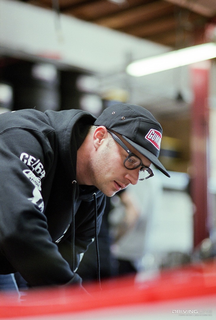 Ryan Tuerck Looking at engine compartment of Toyota GT86