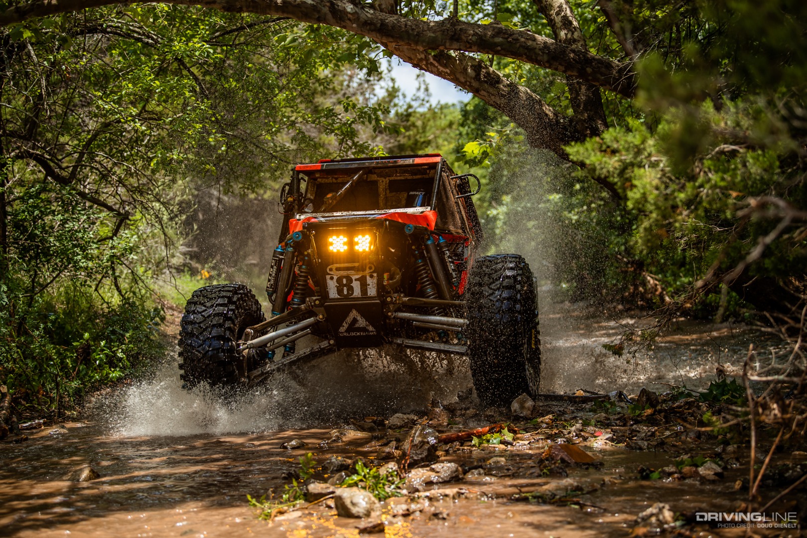 Levi Shirley racing through a river