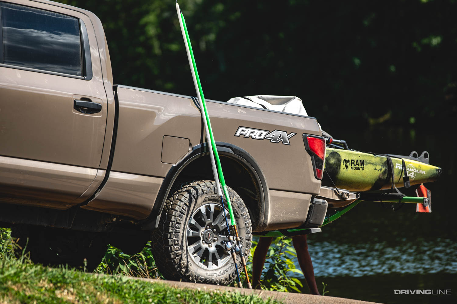 Hobie kayak in bed of Nissan Titan on Nitto Ridge Grappler Tires