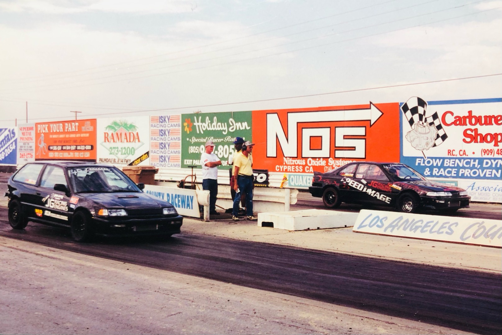Ron Bergenholtz (right) lining up alongside Stephan Papadakis's EF Honda Civic at Irwindale Speedway