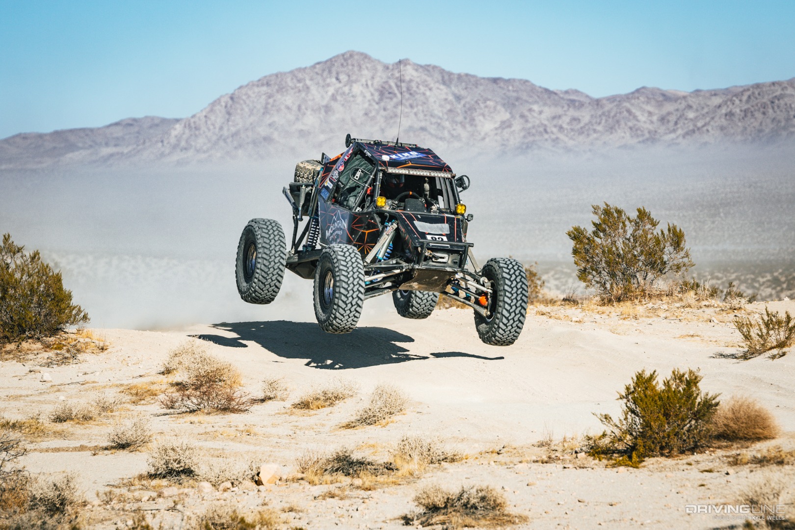 JP Gomez's rig in the air going over a berm
