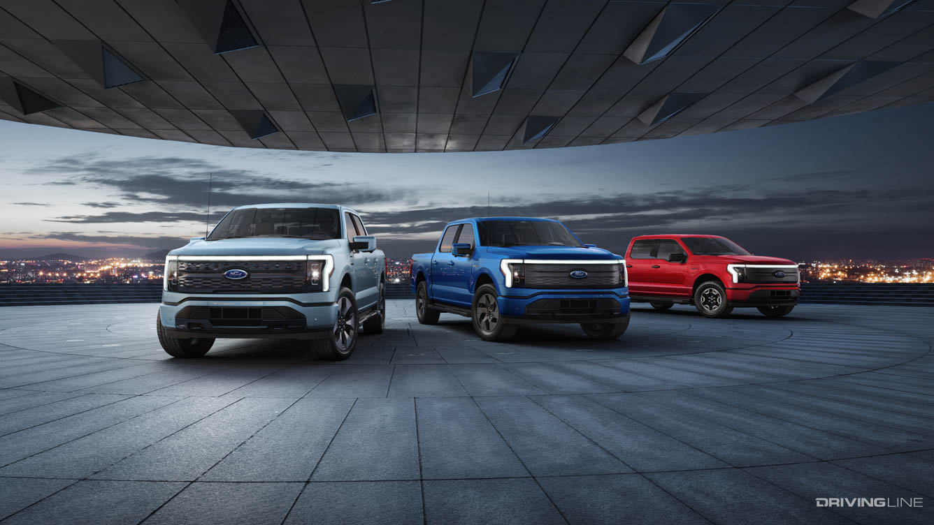 Three new Ford F-150 All- electric Lightning Trucks white, blue and red
