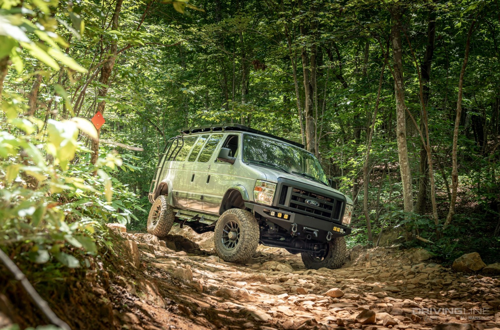 Ford E-350 4x4 Van Conversion Ujoint Offroad in forest