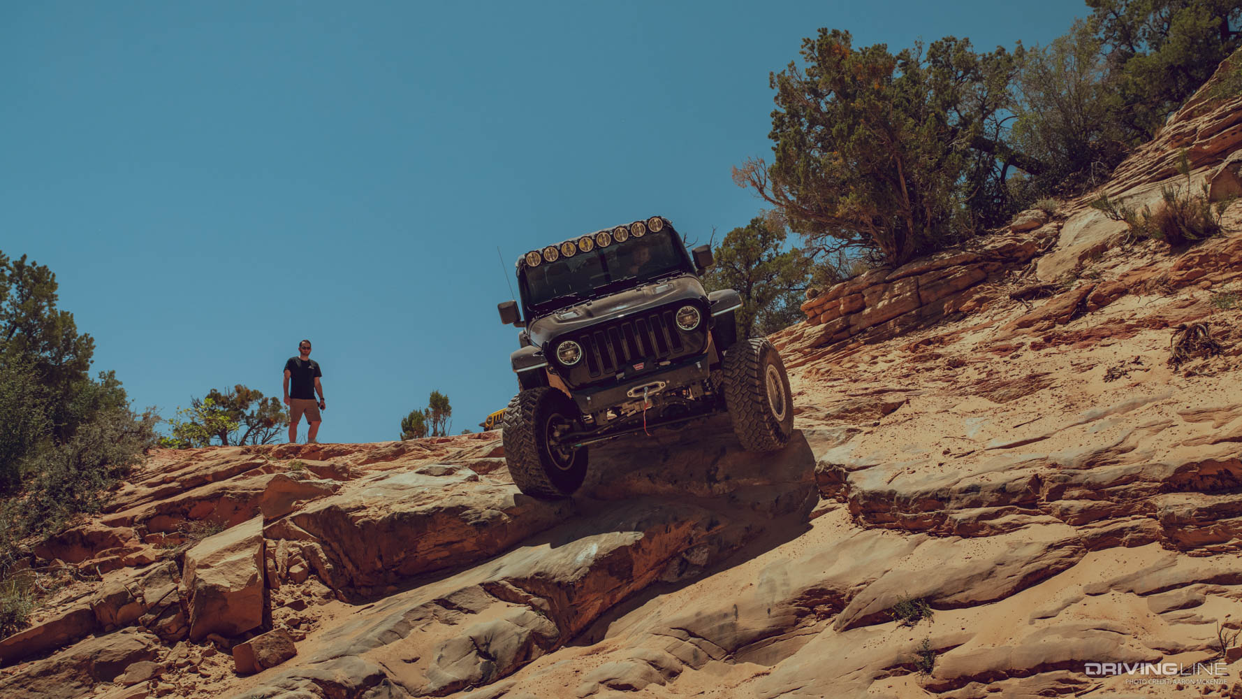 Jeep driving down steep grade on Nitto Trail Grappler tires
