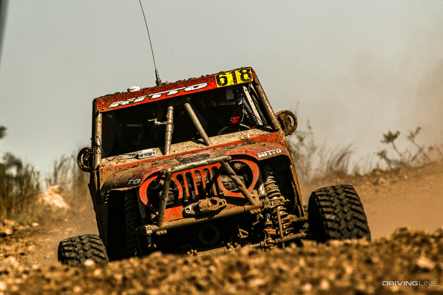 Casey Gilbert driving over a small hill