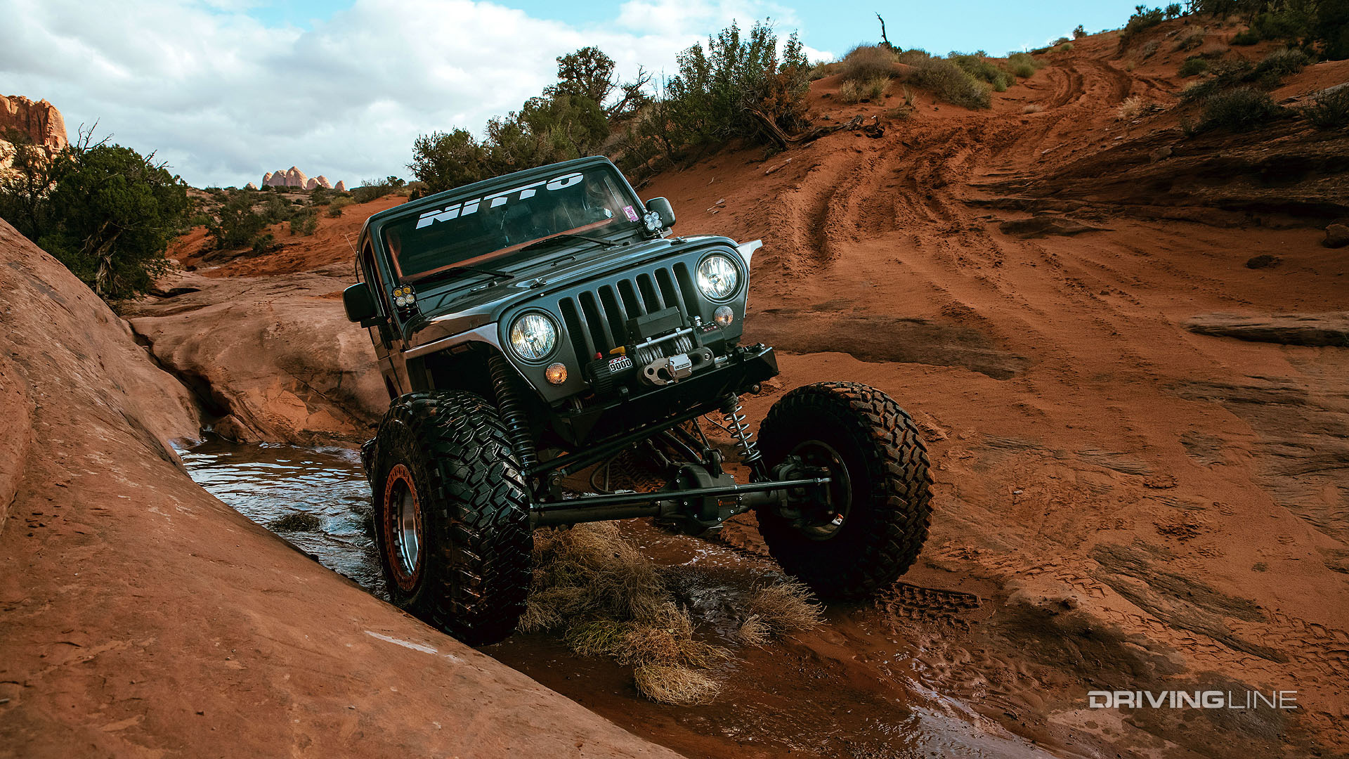 jeep off roading in water at moab