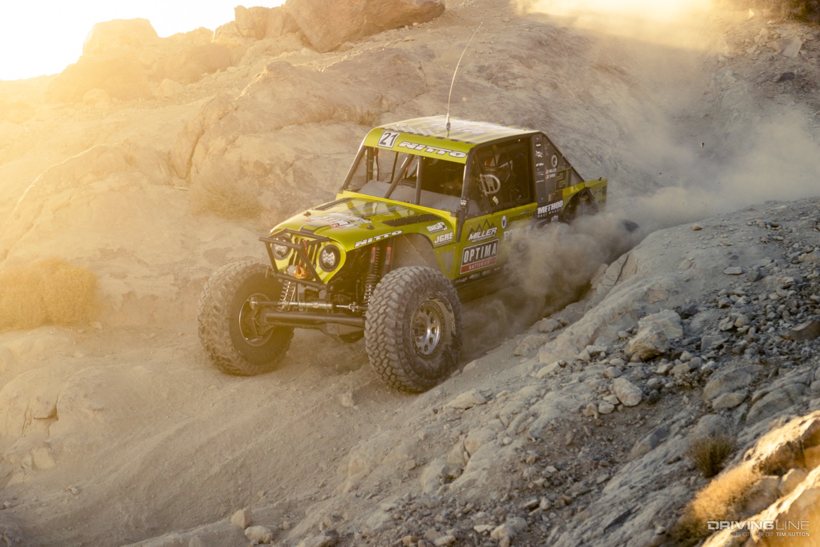 Erik Miller driving down a dirt hill