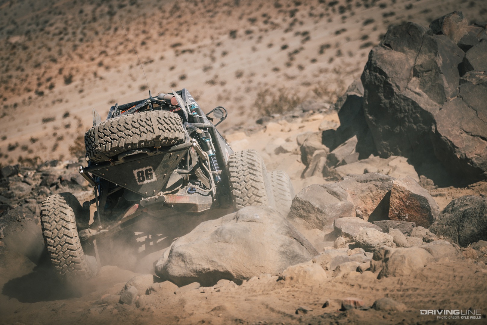 Marcos Gomez driving away into the desert