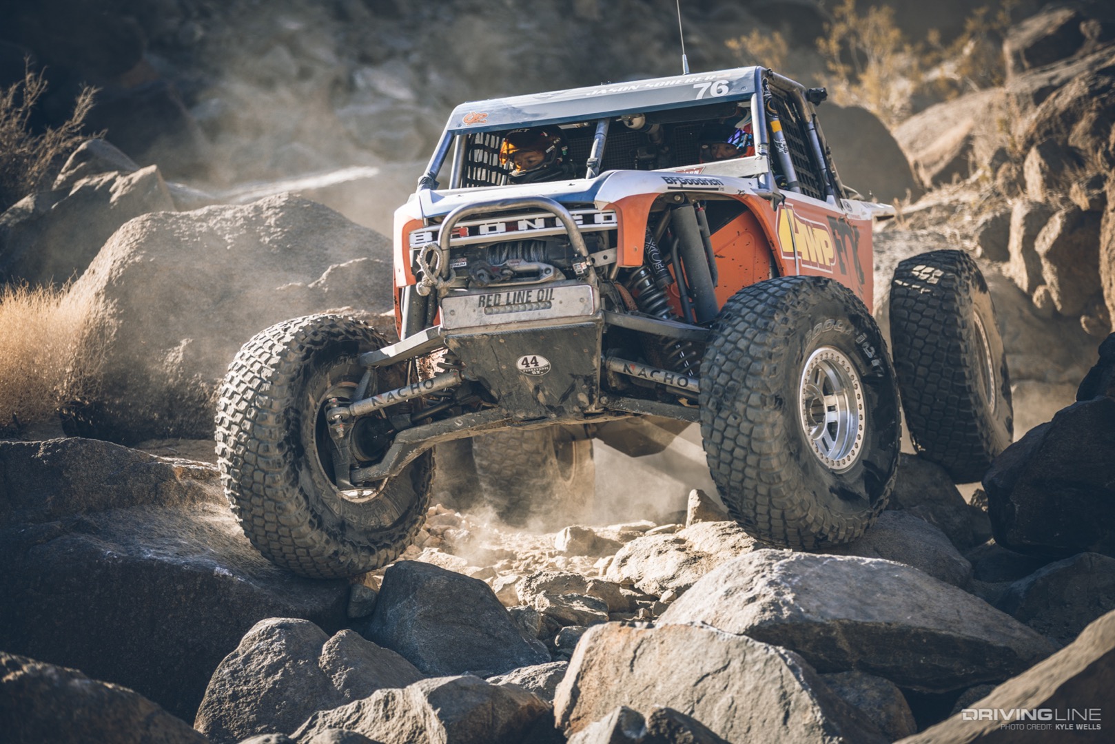 Jason Scherer driving over large rocks