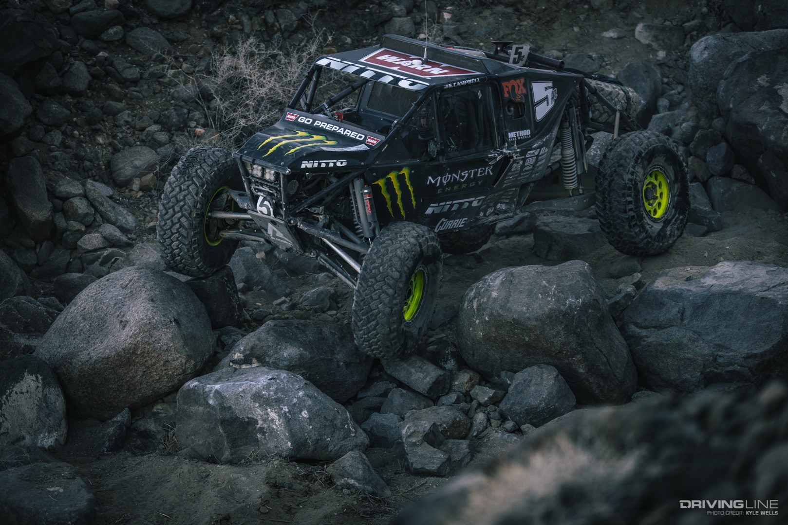 Shannon Campbell navigating down some boulders