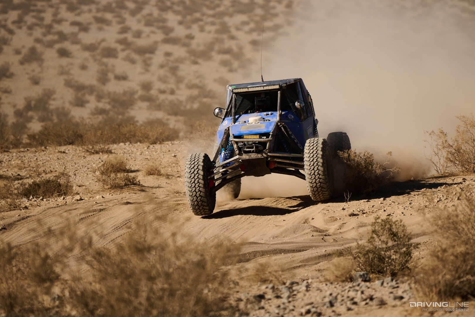 Raul Gomez driving across the desert