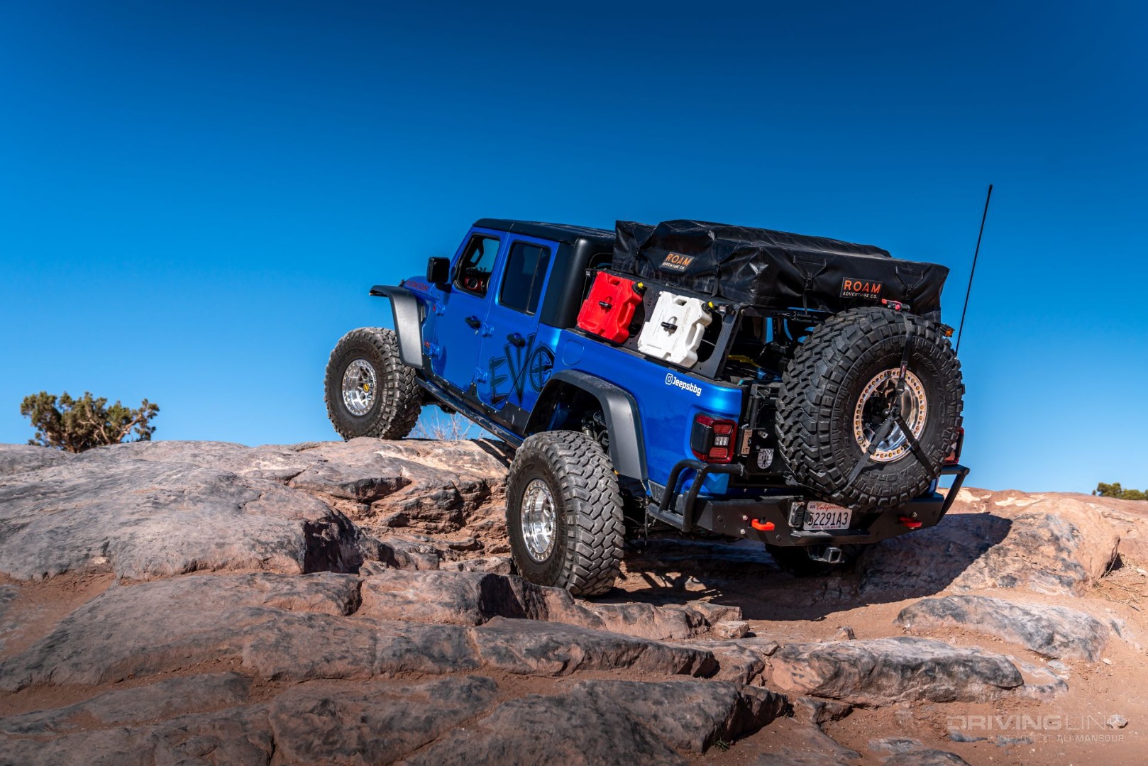 Jeep Gladiator Rubicon on 40s Overland Build crawling up rocks off-road