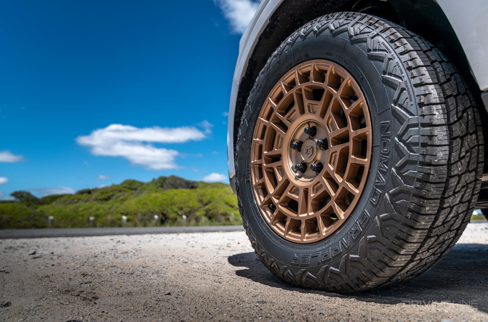 Close up three-quarter detail of Nitto Nomad Grappler Crossover terrain tire