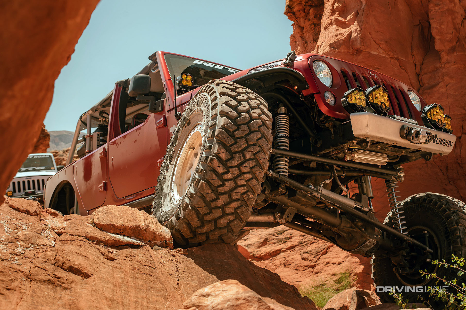 carbon off road jeep climbs desert rocks with nitto trail grapplers