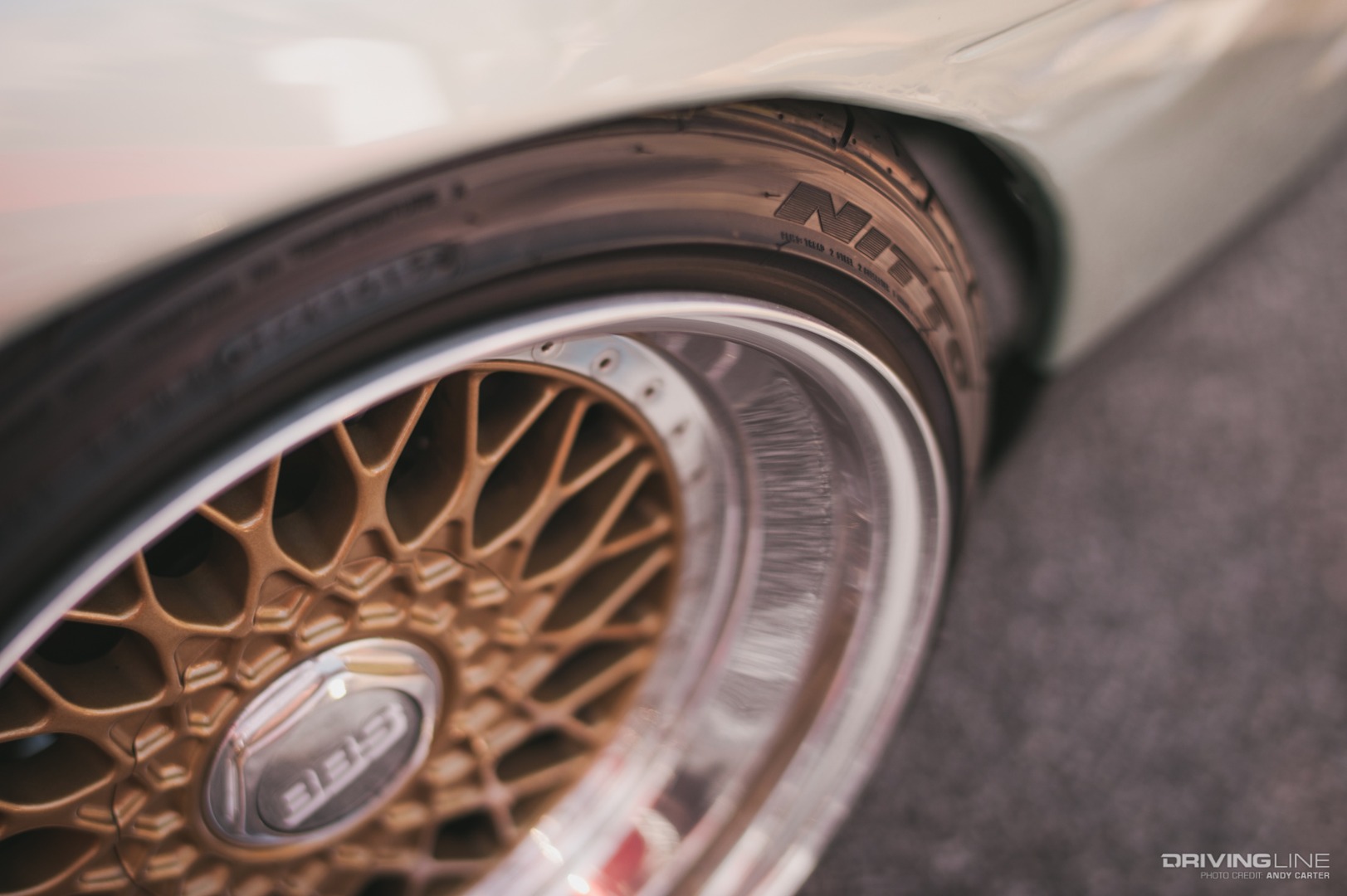 Lowered car on Nitto tires wheel in focus