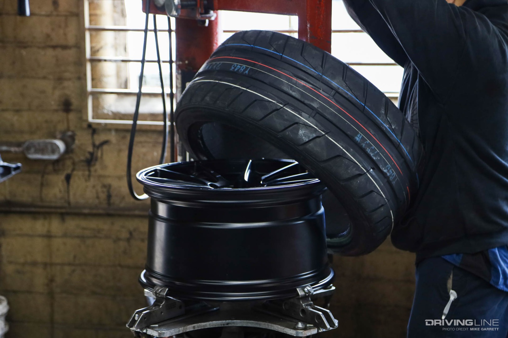 Tire being mounted on rim