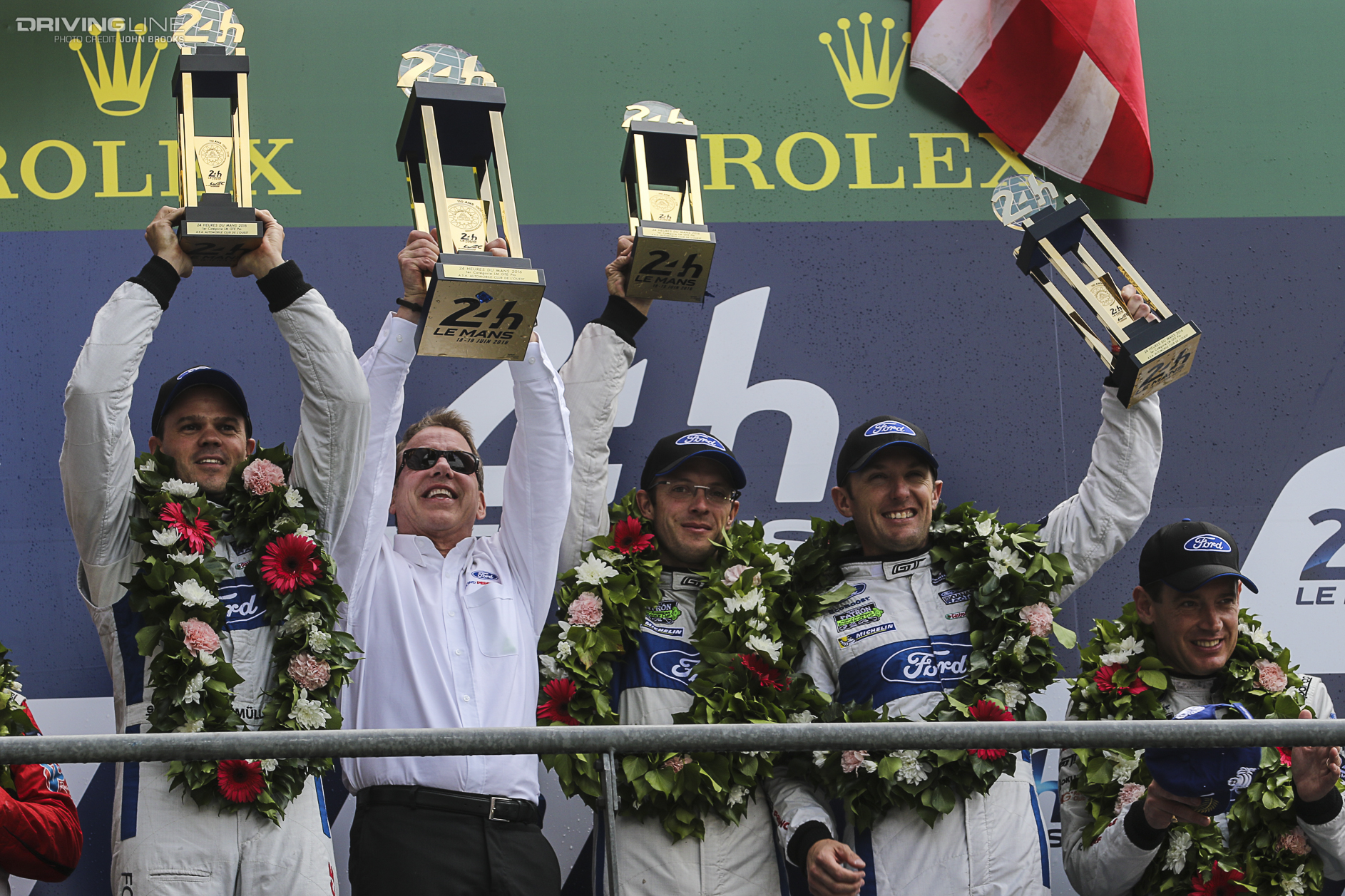 Ford GT team holds up trophies at Le Mans 2016