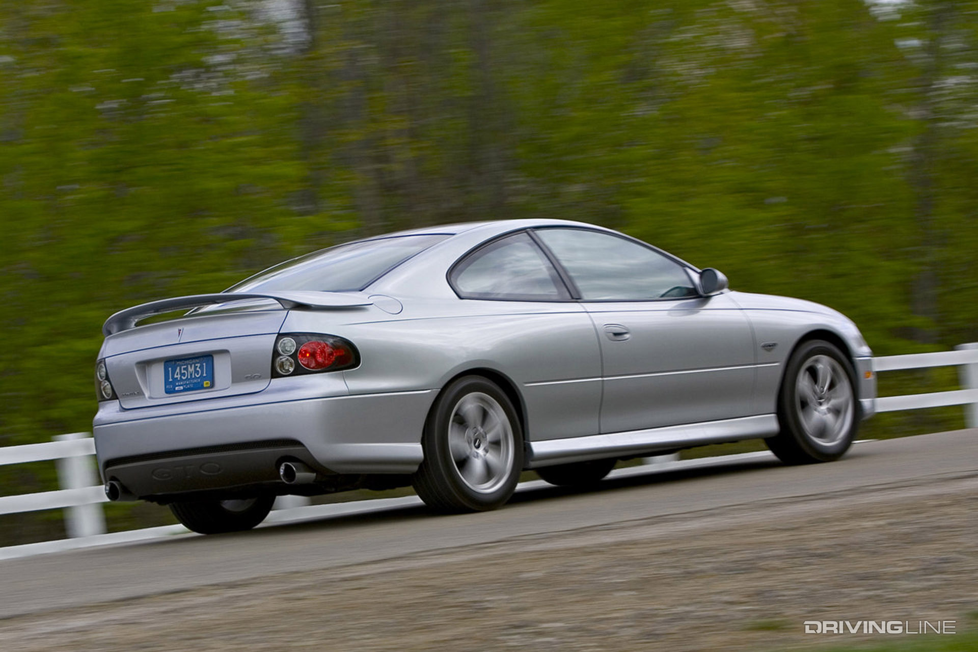 Silver 2006 Pontiac GTO driving