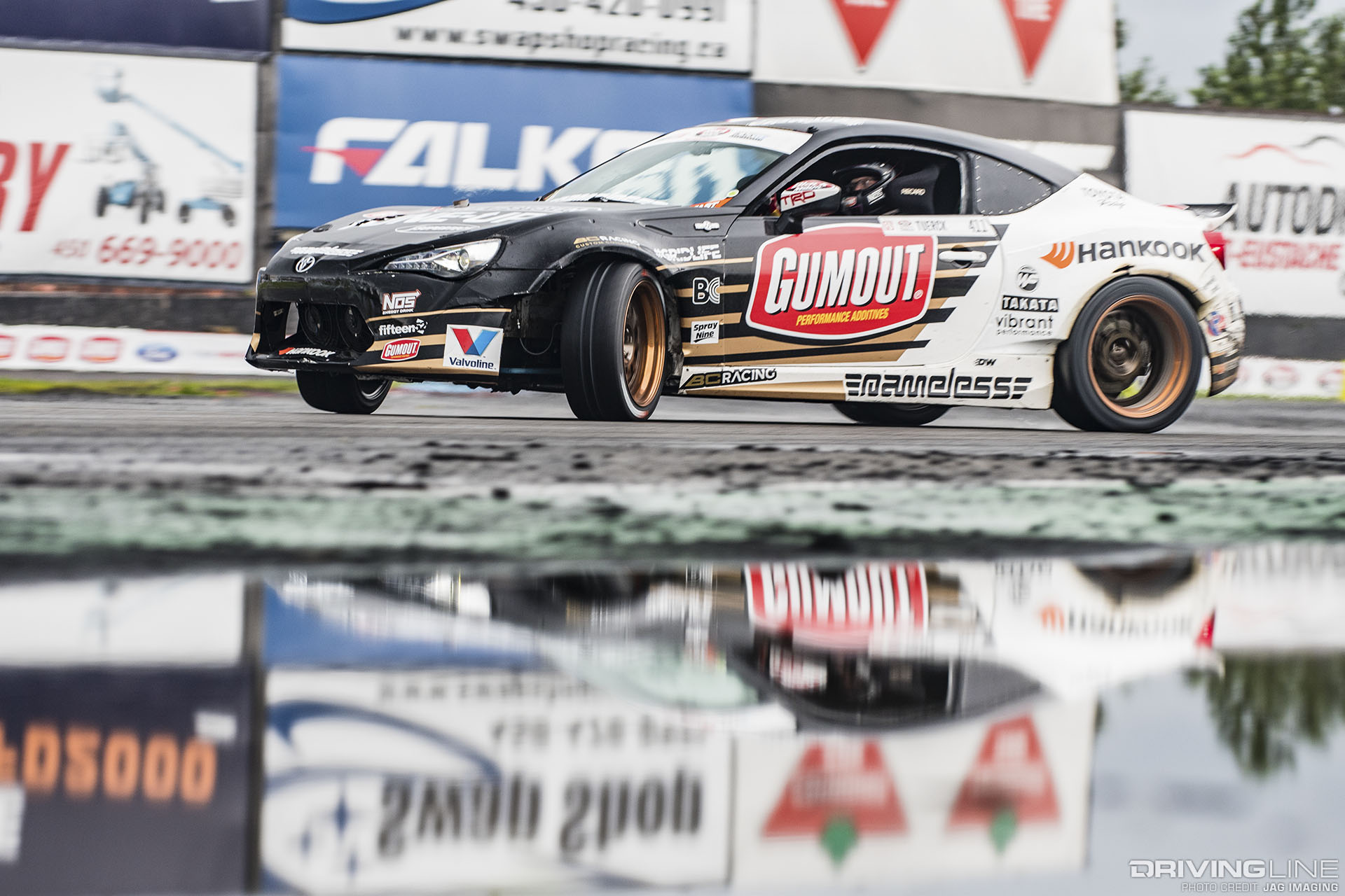 Ryan Tuerck in front of rain puddle