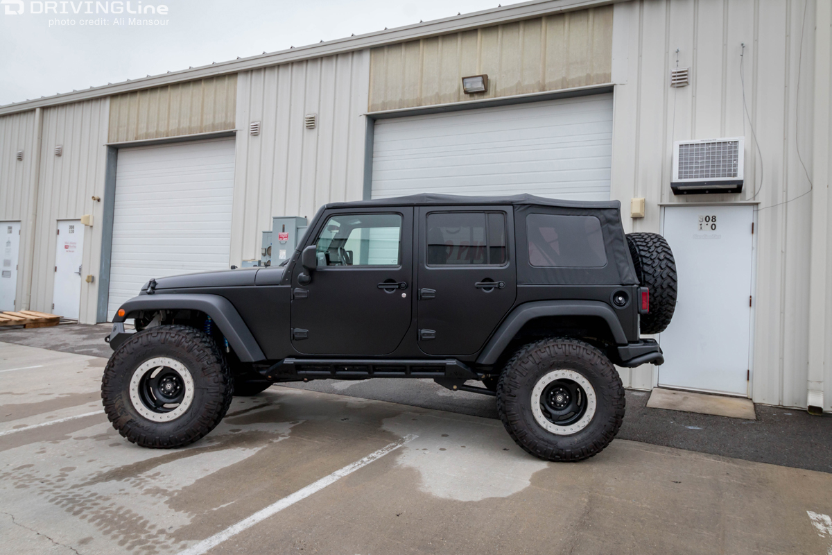 Side of Jeep Wrangler JK with a 3M 1080 Satin Black vehicle wrap installed