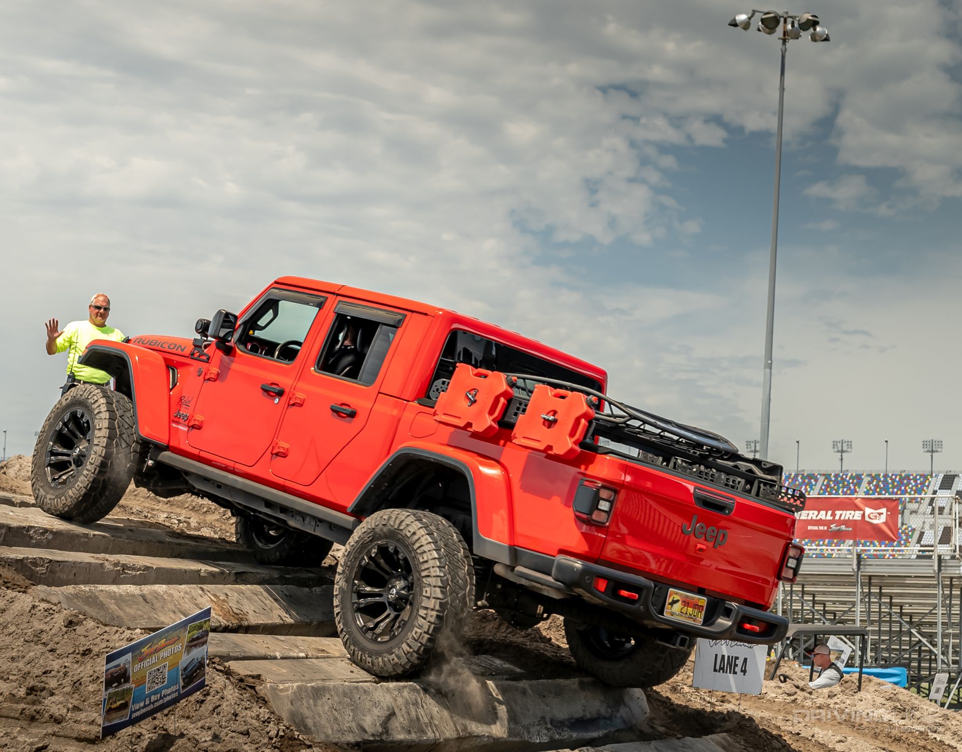 Red Jeep Gladiator Rubicon on Nitto Ridge Grapplers on obstacle course at Daytona Speedway