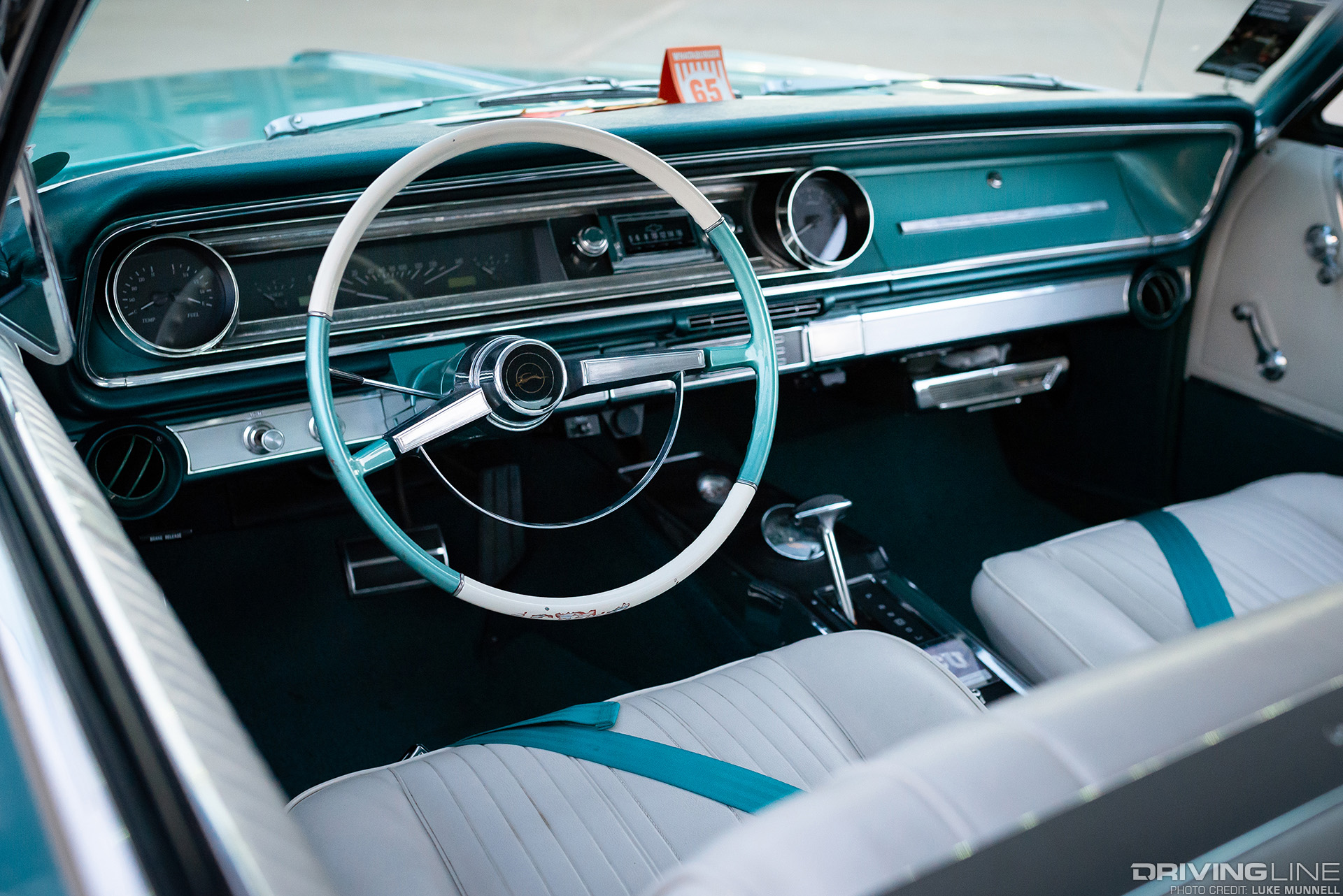 driver pov of 1965 chevy impala custom with nitto tires