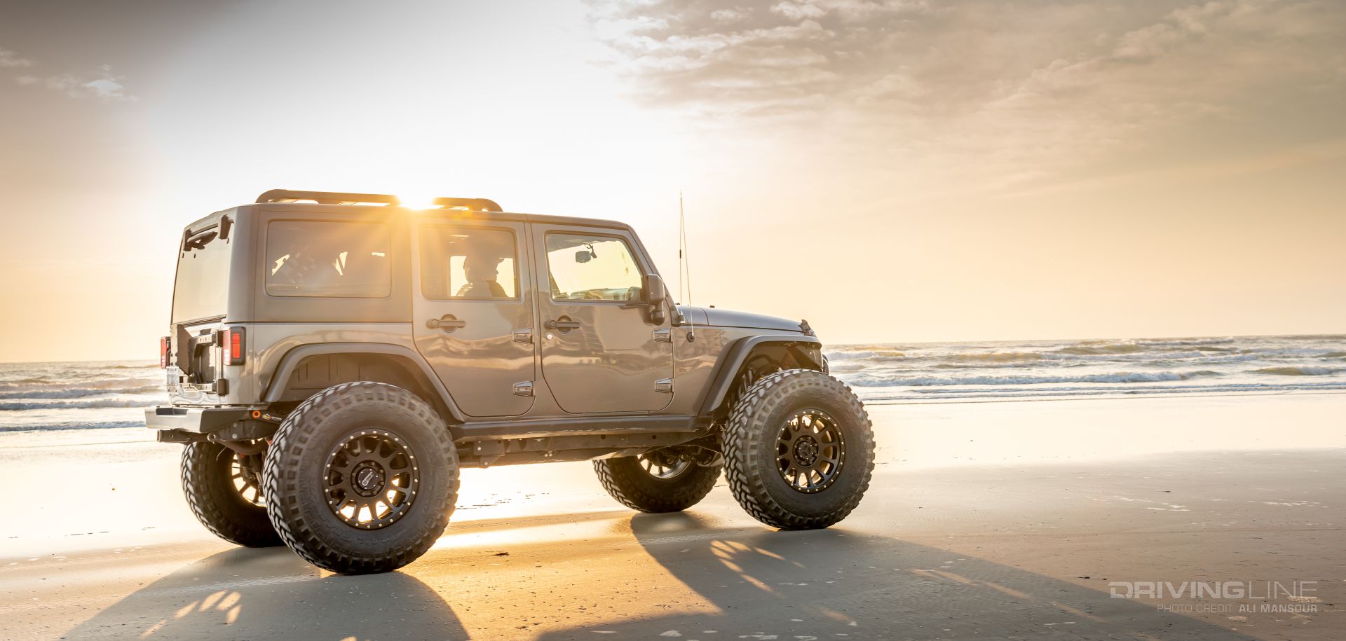 Erik Miller 2016 Jeep Wrangler JK on 42 Nitto Trail Grapplers Driving on Daytona Beach at Sunrise