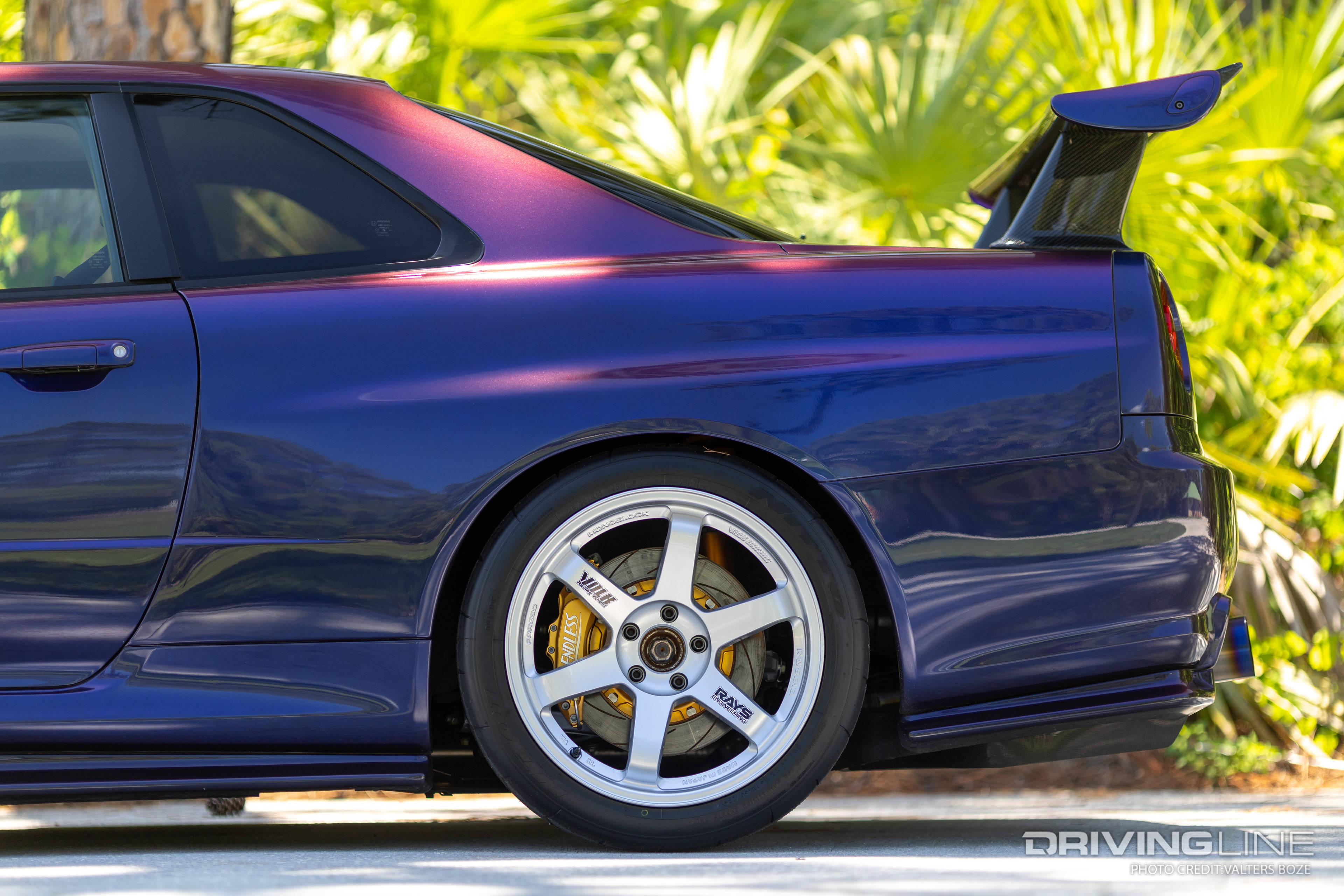 The stance of Adam LZ's Nissan Skyline R34 is handled by a set of Ohlins Road and Track coilovers