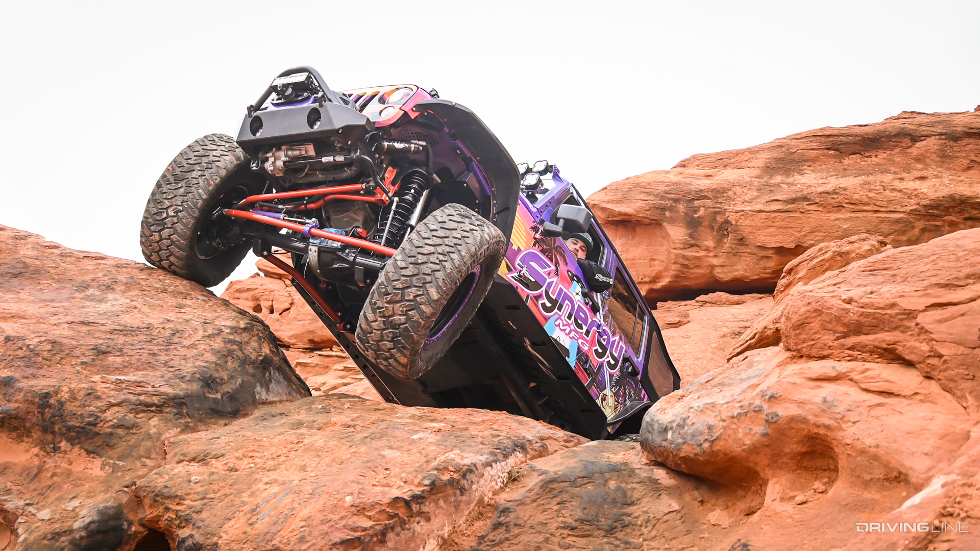 Jeep JK built by Synergy MFG off-roading in big rocks