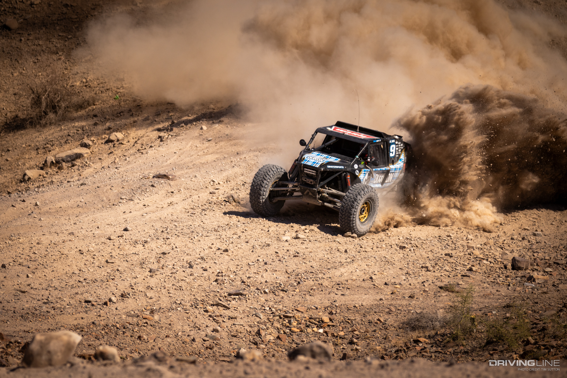 bryan Crofts kicking up dirt in his Nitto Trail Grappler equipped 4400-Class Ultra4 car